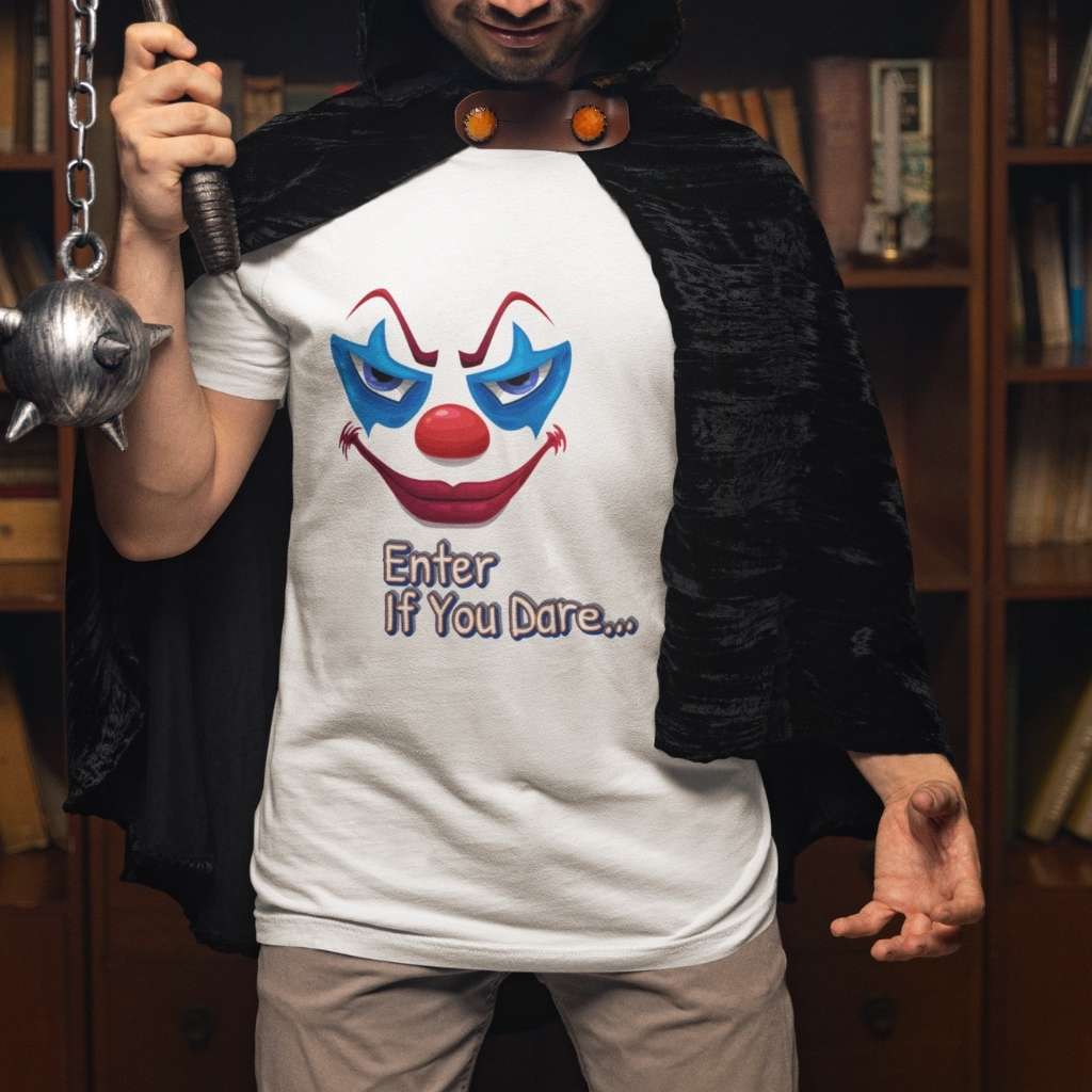 Close-up of a person in a terrifying clown mask and red wig holding a mace, wearing the "Enter If You Dare..." graphic t-shirt.